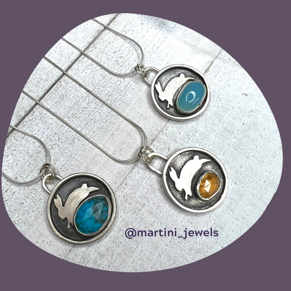 Image of 3 pendants showing different gemstones with rabbit