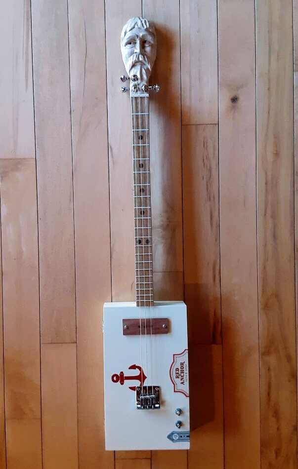 Custom Cigar Box Guitar with hand carved face on headstock