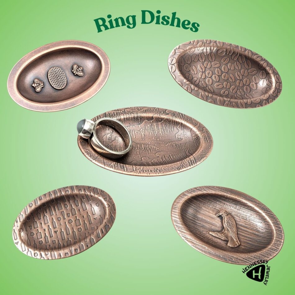 5 oval copper ring dishes. Bees and honeycomb, coffee bean texture, aurora borealis texture, wine bottles texture, raven.